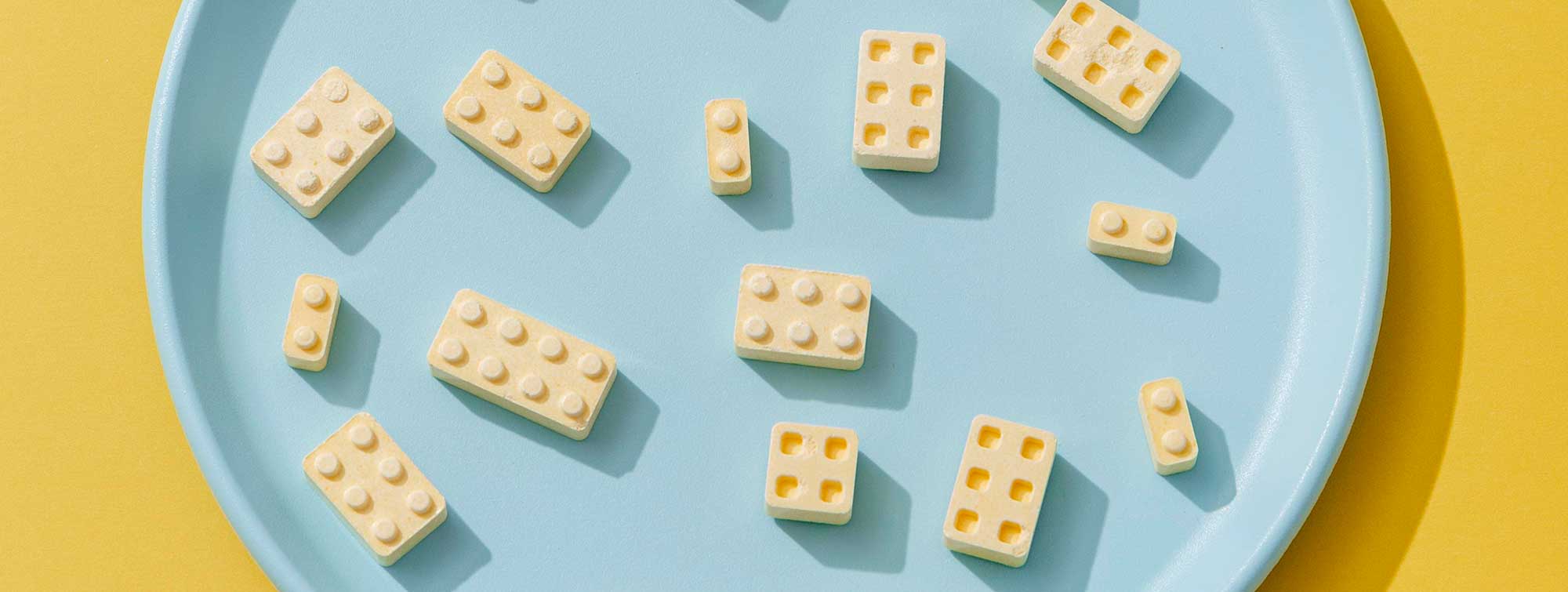 Cheese in shape of Legos in a plate