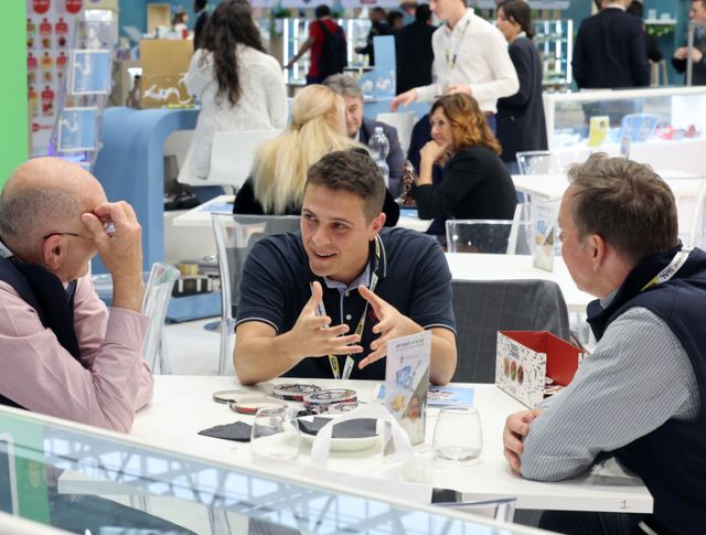 Buyers discussing around a table during a B2B meeting at an international food trade show
