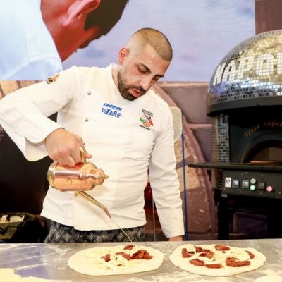 Pizza chef preparing authentic Italian pizzas during a live cooking demonstration at SIAL Shanghai.
